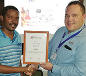 Juaandr&$233; Heyneke (right) presents new member Harry Kelly with the SAIMC certificate.